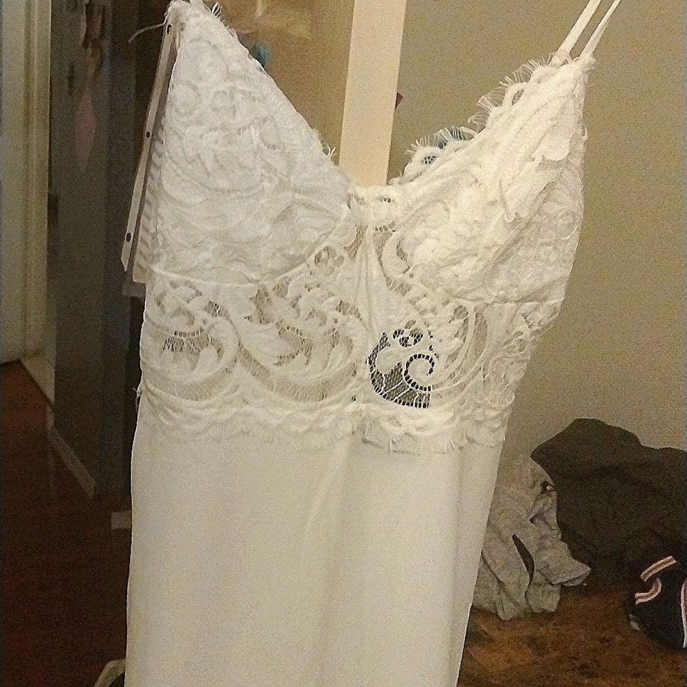 White laced top Romper size Medium by Fashion Nova